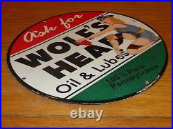WOLF'S HEAD OIL & LUBES 11.75in ROUND METAL SIGN 